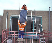transporting solar panels and ballast  from terrace to flat roof