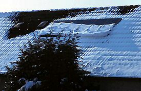 Snow melting off from neighbour's PV-system consisting of 6 108 Wp solar panels with OK4 inverters mounted below the panels.